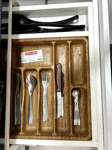 a drawer with utensils in a cabinet at Apartamento Centrico en Bab Okla in Tetouan