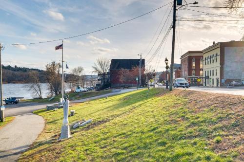 a grassy field with a cross on the side of a street at Cozy Water-View Apt in the Heart of Downtown! in Hallowell