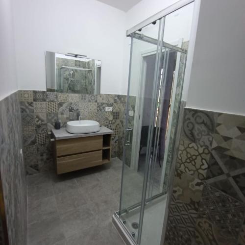 a bathroom with a glass shower and a sink at B&B Ginevra in Porto San Giorgio