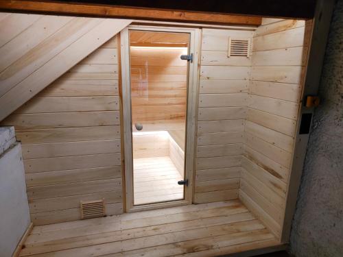a sauna in the attic of a house at Leszczynowy domek nad jeziorem in Dobre Miasto
