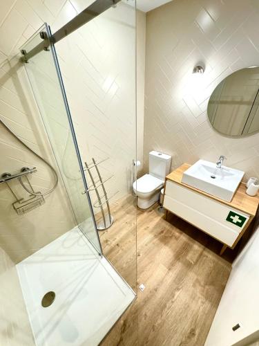 a bathroom with a shower and a sink and a toilet at Refúgio Verde Douro in Marco de Canaveses