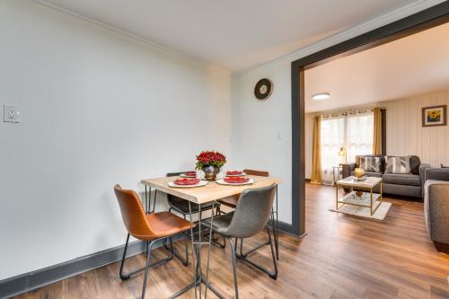 a dining room and living room with a table and chairs at Radiant Arden Home - 10 Mi to Biltmore! in Arden