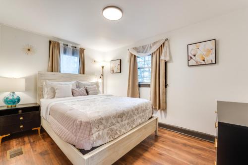 a bedroom with a large bed and a television at Radiant Arden Home - 10 Mi to Biltmore! in Arden