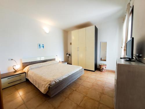 Giường trong phòng chung tại Stella del Coghinas