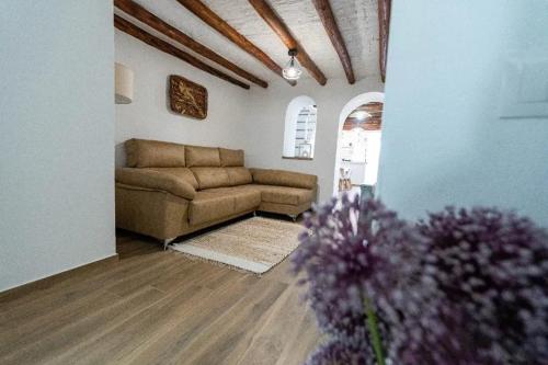 a living room with a couch and a table at Spacious house in Olvera with private pool in Olvera
