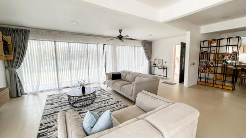 a living room with a couch and a table at Nur Villa Sg Soi Musslimm Only in Kuantan