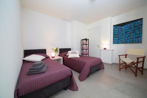 Posteľ alebo postele v izbe v ubytovaní AgriturismoB&B Loggia Degli Artisti