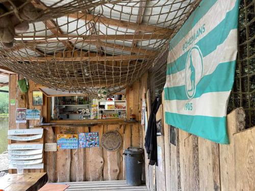 a food stand with a flag on the wall at Houseboat U Vodníka in Krásná Hora