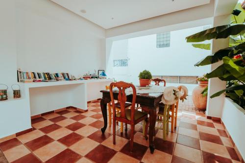 a dining room with a table and chairs at Saronis Hotel Agistri - Adults Only in Skala