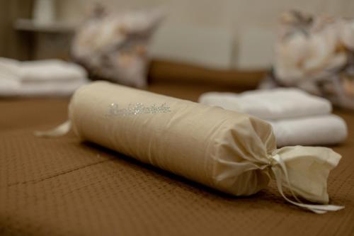 a roll of toilet paper sitting on top of a table at La Dimora dei Nipoti in Bari