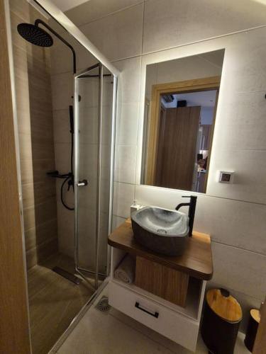 a bathroom with a sink and a shower at Argyro's home, Μοντέρνο Σπίτι σε Γραφικό Χωριό in Kritsá
