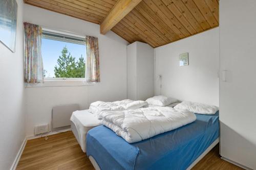 Ένα ή περισσότερα κρεβάτια σε δωμάτιο στο Skytten 5 - Environmentally Friendly Holiday Home