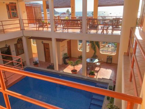 a view of a building with a swimming pool at Seville Suite in San Juan del Sur