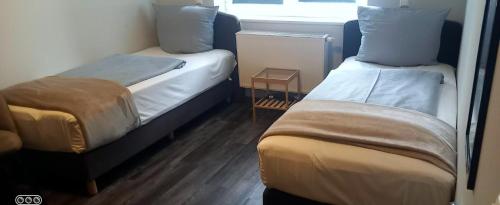 Ένα ή περισσότερα κρεβάτια σε δωμάτιο στο Lieth-Hotel-Grünreich