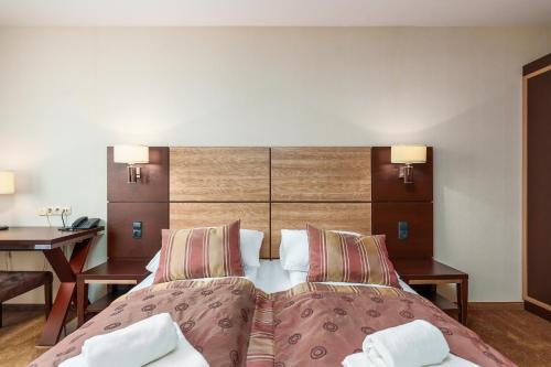 Ένα ή περισσότερα κρεβάτια σε δωμάτιο στο Baltic Wave