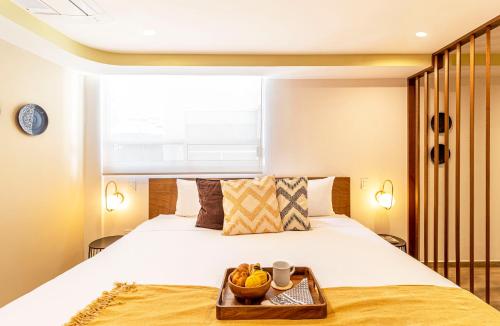 Cama o camas de una habitación en Grand Chapultepec by Kukun