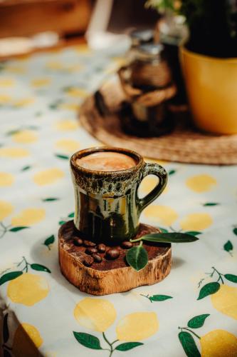 a cup of coffee sitting on a table at Hotel RH Boutique Aruba in Oranjestad