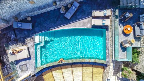 an overhead view of a swimming pool at Asion Lithos in Kato Asites