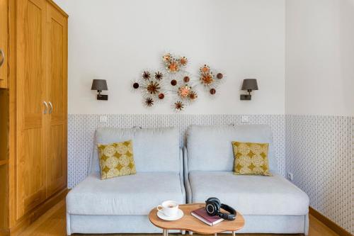 a living room with a couch and a table at Villa Elisa M in Aubenas