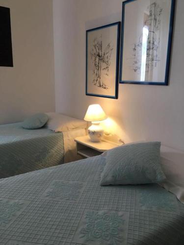 Una cama o camas en una habitación de Hotel Su Barchile