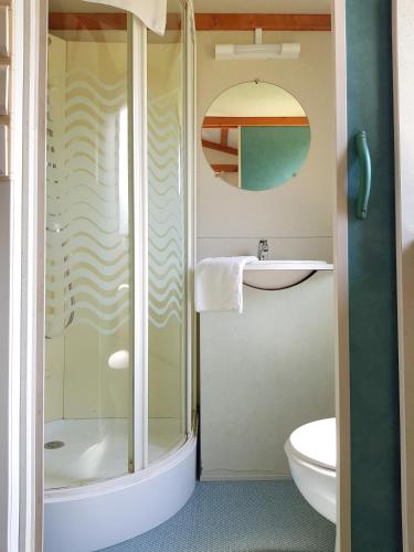 a bathroom with a shower and a sink at Camping L´Amuravela in Cudillero