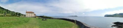 a retaining wall next to a body of water at ATICO TORRONTERO in Mundaka