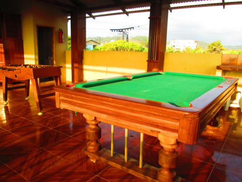 a pool table sitting inside of a room with at Hotel Mediterraneo in Canoa