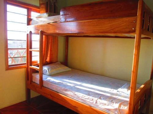 two bunk beds in a room with a window at Hotel Mediterraneo in Canoa