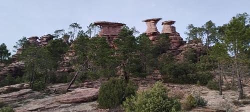 a group of rock formations on a hill at Luz de Carboneras in Carboneras de Guadazaón