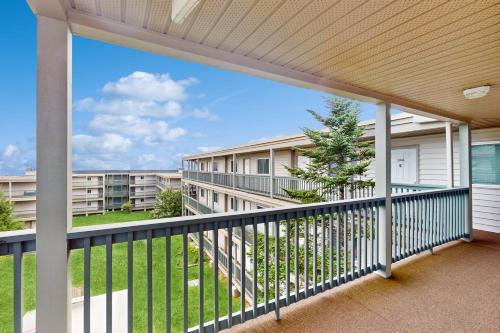 a balcony with a view of a building at Pinnacle Inn #3302 in Beech Mountain