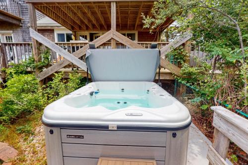 a hot tub in the backyard of a house at Bayview in Truro