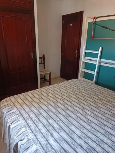 Ένα ή περισσότερα κρεβάτια σε δωμάτιο στο Casa Mar Baltico a 200 m de la Playa La Barrosa