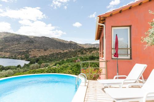 a villa with a swimming pool and a house at Olhares do Douro in Torre de Moncorvo