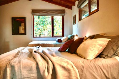 Voodi või voodid majutusasutuse El Bosque 2 Casa en Cerro Otto, Bariloche toas