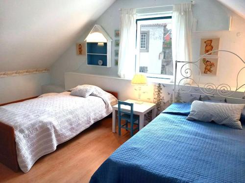 Postel nebo postele na pokoji v ubytování St Francisco House Sintra