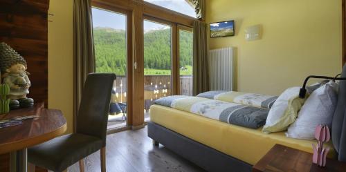 Ένα ή περισσότερα κρεβάτια σε δωμάτιο στο Hotel Piccolo Mondo