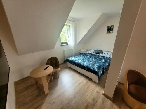 Postel nebo postele na pokoji v ubytování Dom Gościnny Harry