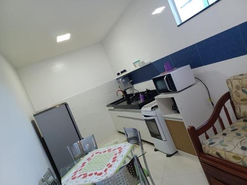 Dapur atau dapur kecil di SanGus SUÍTES Cabo Frio