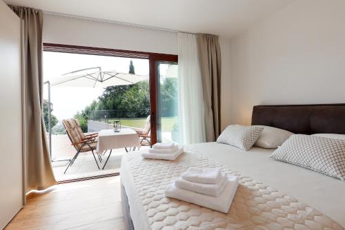 Ένα ή περισσότερα κρεβάτια σε δωμάτιο στο Apartments Silvi
