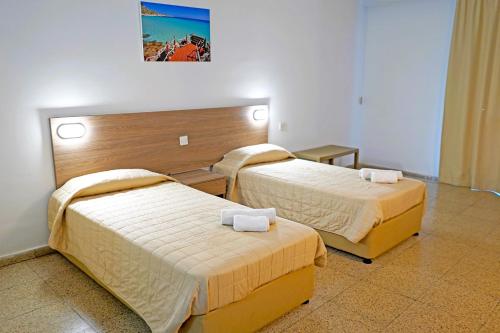 Postel nebo postele na pokoji v ubytování Green Bungalows Hotel Apartments