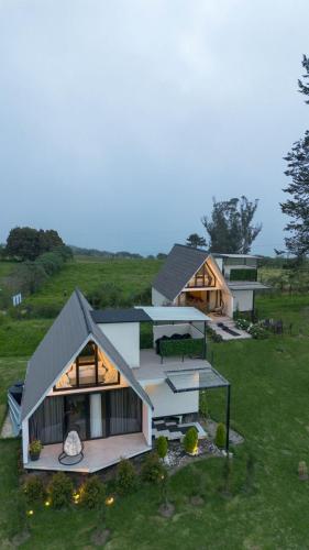 an aerial view of a house in a field at Glamping Al Pie del Cerro in San Fernando