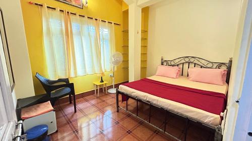 Ένα ή περισσότερα κρεβάτια σε δωμάτιο στο Muffys Vacation Villa