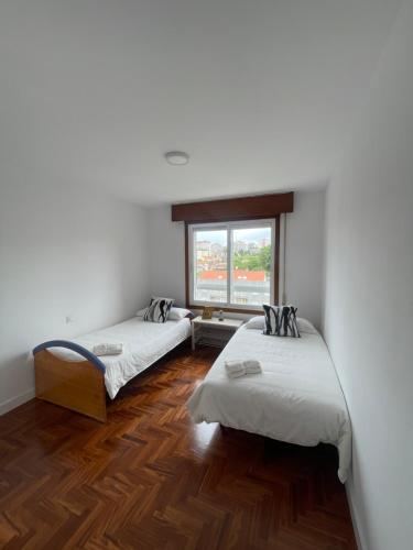 Ένα ή περισσότερα κρεβάτια σε δωμάτιο στο Apartamento Balaídos Vigo
