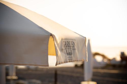 a piece of paper with a sign on top of a roof at Hotel Garden in Praia a Mare