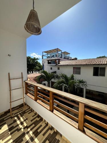 a balcony with a view of a building at Pousada Isabel Araújo in Jericoacoara
