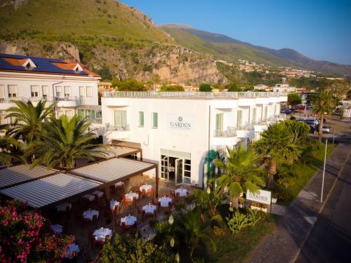 an aerial view of a hotel with mountains in the background at Hotel Garden in Praia a Mare