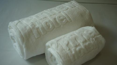 a white block of soap sitting on a table at Pinheiros Hotel in Goiânia