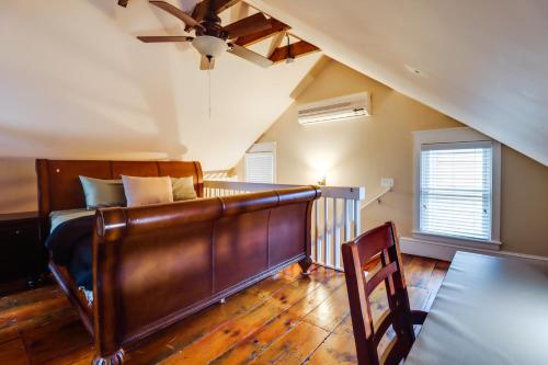 a bedroom with a bed and a ceiling fan at Charming and Historic Home with Lehigh River View in Parryville
