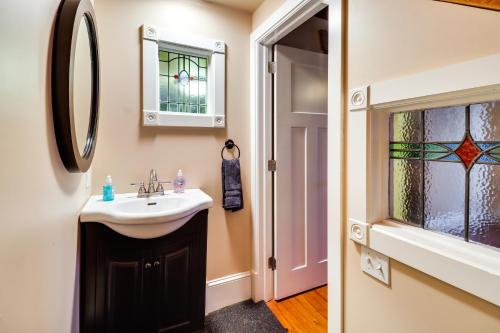 a bathroom with a sink and a mirror at Charming and Historic Home with Lehigh River View in Parryville