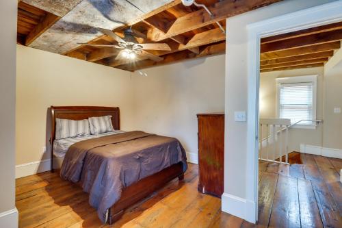 a bedroom with a bed and a wooden ceiling at Charming and Historic Home with Lehigh River View in Parryville